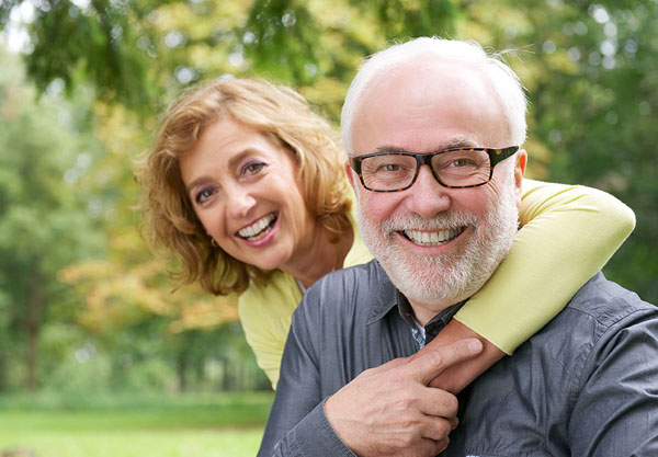 couple hanging out in the park, while hugging her husband